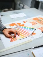 Print house worker controlling printing process quality and checking colors with magnifying glass. SSUCv3H4sIAAAAAAAACnRRy07DMBC8I/EPkc+NSEhCmx45IHFA4l5x2NjbZlXXjvwoQlX/HTuPYiS4eWbWszu7l/u7LGMdWOJsm10iCpik9NYZcKRVoIvVzBtUAk3KnE31VKQEUIpQkNOGQKZkB473Ck4YSOWljPR1FJl14LxFG2eZKQ4OD8FjIm8W08C7CWeLMIrhR5DYqxIxRGy+SlTru6i+keUoJSjU3rJFn3r+Y/jsLSm09uGFFCiOf9m+ox4k/vhNj4/bdg6o+NeYLkltUCJMqXdTKTt+OjSndA/gBelkBWfNQcaCKnECGsDAr3+DIU7qkDDa9eMRFyeuvXImTsWWSExqPUAXkmyzfWiDC9+DtaFcLHzSm4dt61PSR2k3ZppdmQiXjLCsqrpp1vWmaou6bDfVei6Yrt9T8BnHWYwC5kcSaSqKE7BaBJ/HYp8/7esyr8V+nW84QM5RYNE1vGnLNtzi+g0AAP//AwCt2lz75gIAAA==