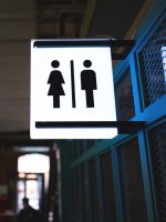 Toilet sign for male and  female on the wall in shopping center